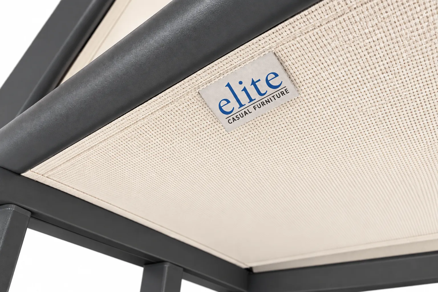 Cream woven sling fabric and Elite Casual label on a dark aluminum frame